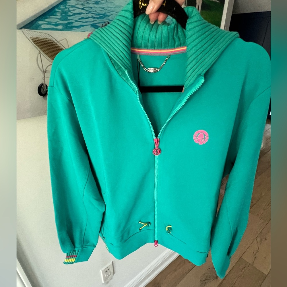 Sportalm Women's turquoise sports Jacket. Size 12. Pockets and toggles for fit.